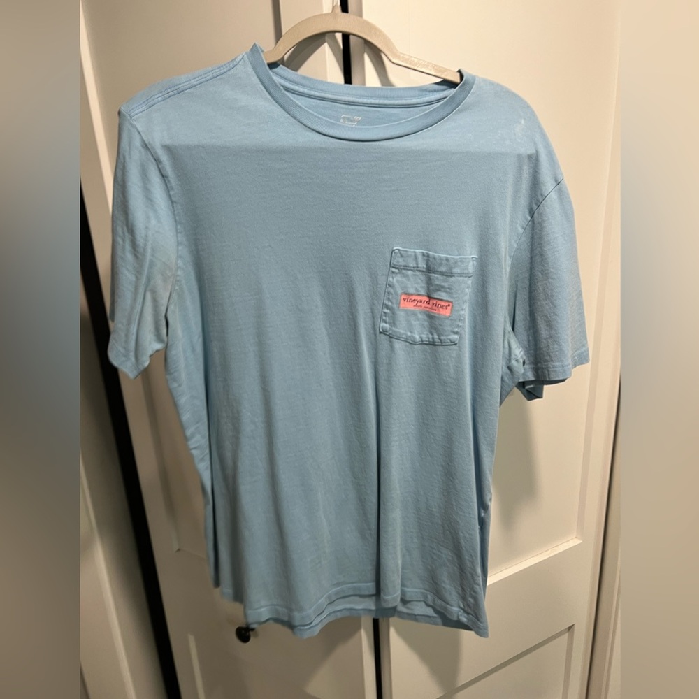 Medium light blue vineyard vines shirt.